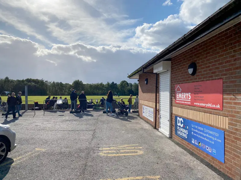 DC Plumbing & Heating sponsorship sign on a football clubhouse
