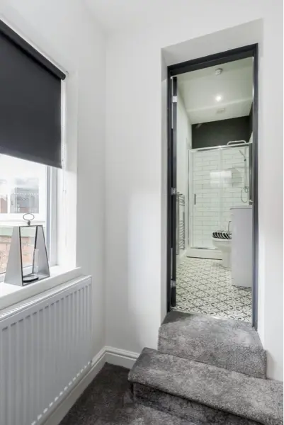 Hallway leading to a newly fitted bathroom