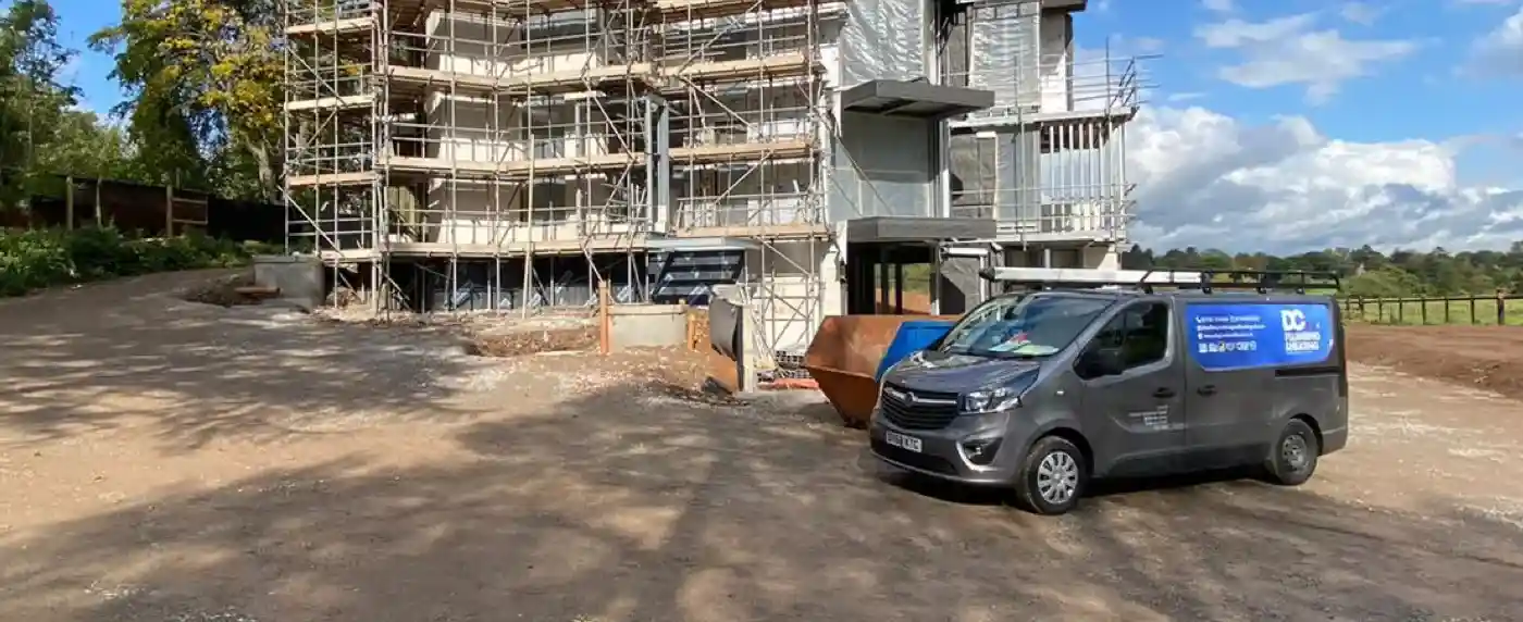 DC Plumbing & Heating van at a new apartment block development